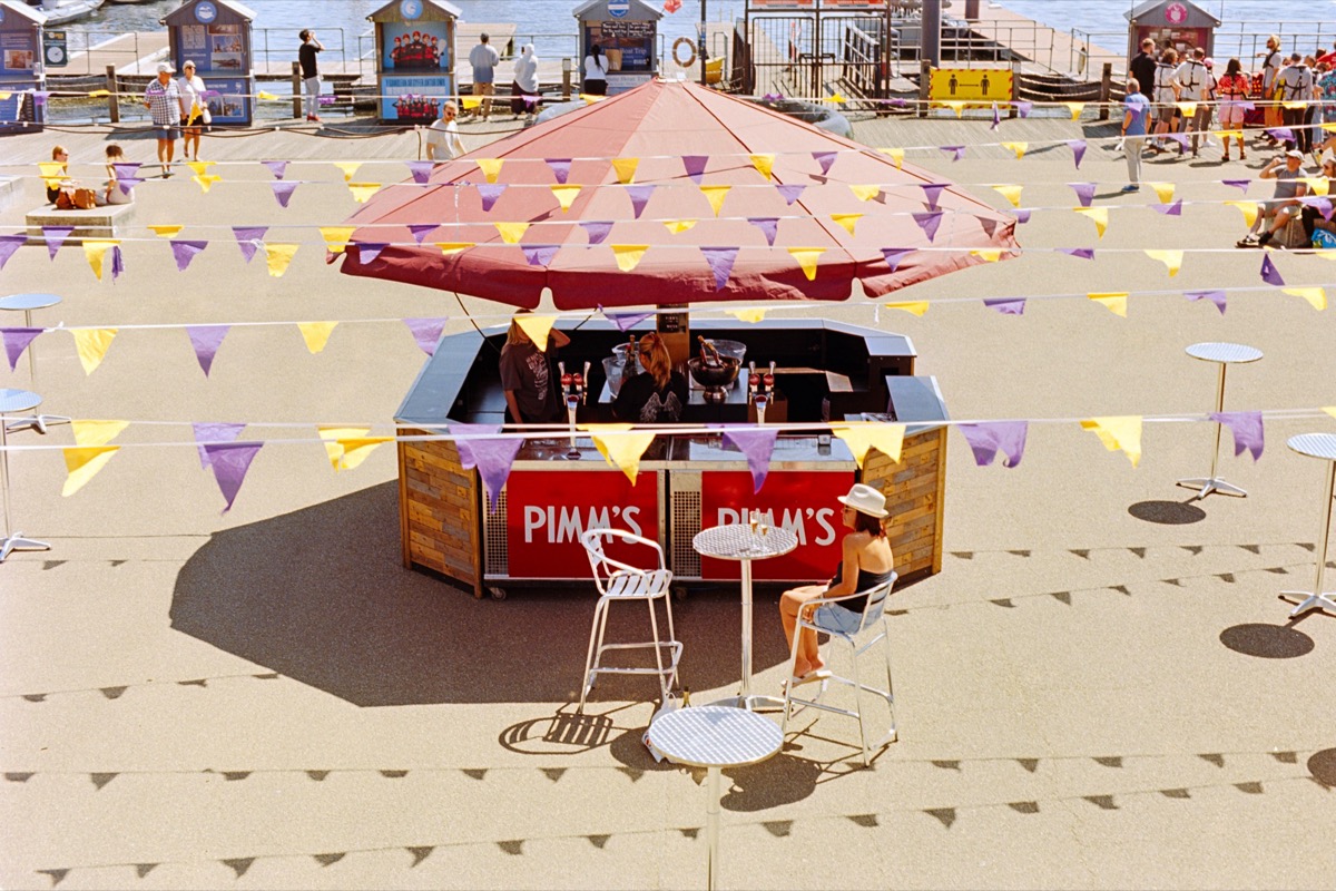 Pimm's stand with bunting at a Welsh seaside promenade